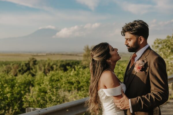Munji and Roshan after their Hindu wedding in Sicily, with Mount Etna behind them
