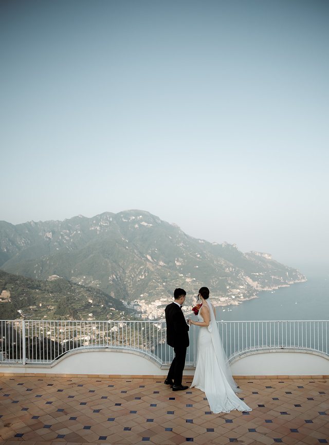 Bride and groom on a terrace above the Amalfi Coast